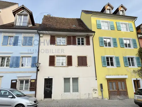 Entièrement loué composé de 2 appartements + 1 local commercial à Delémont
