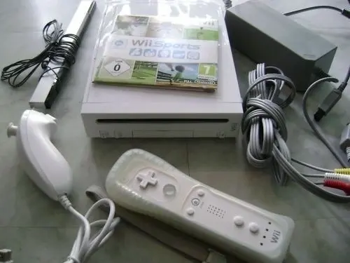 console wii + balance board + jeux  à geneve