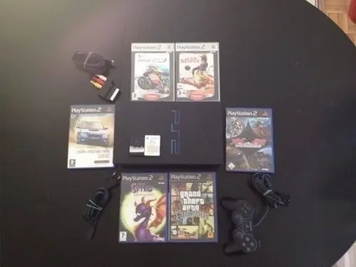 PS2 Fat + 6 jeux Complet à Chéserex