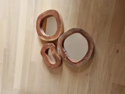 Miroirs ovoides en bois à chesieres