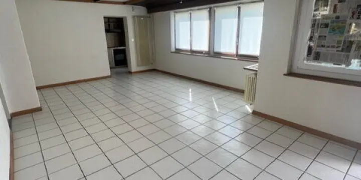 Local commercial de ~52 m2 au rez-de-chaussée à louer à Courtételle