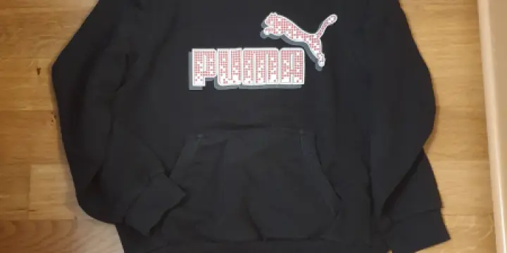 Pull noir a capuchon Puma T140 10.-